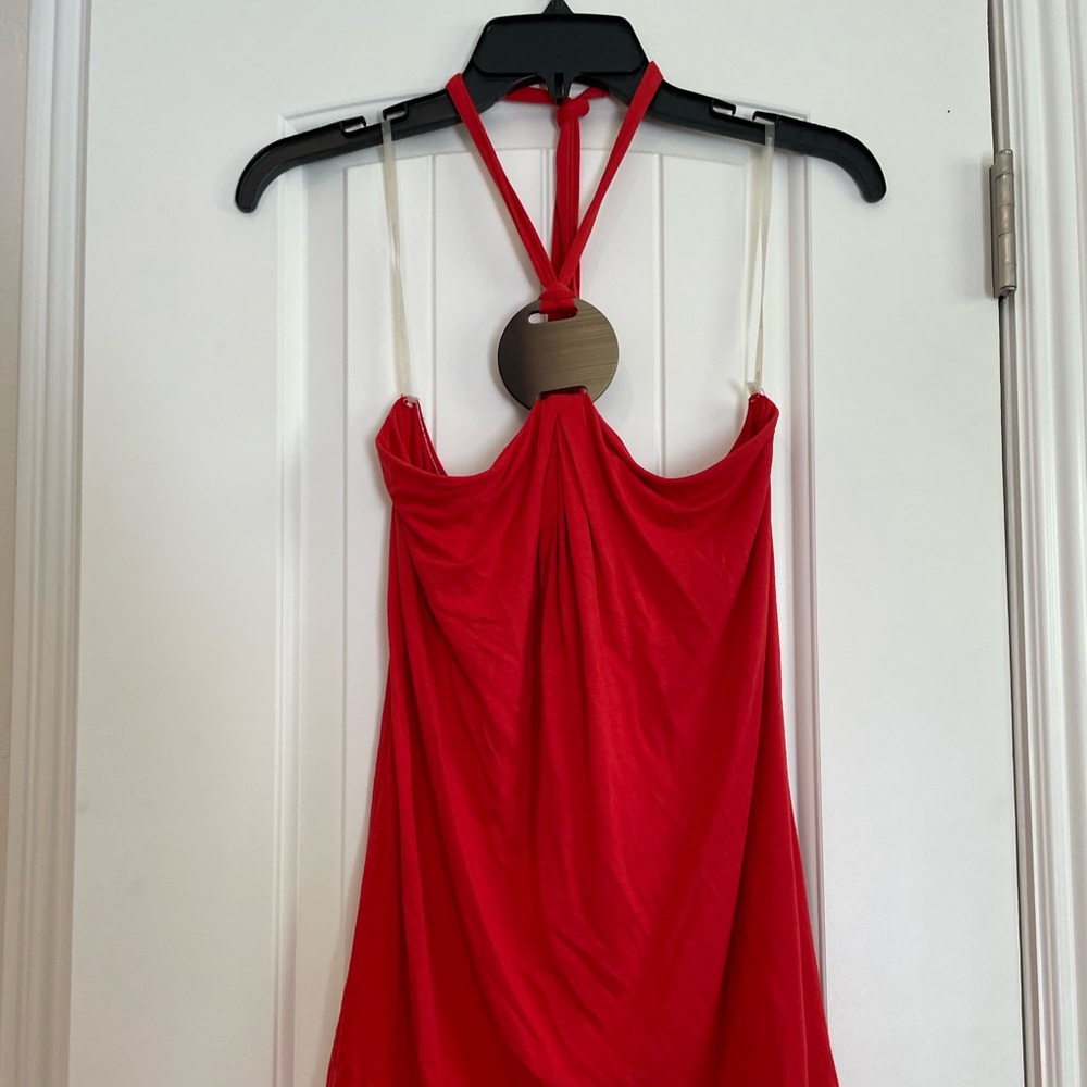Red halter top with wood look emblem. Size small.